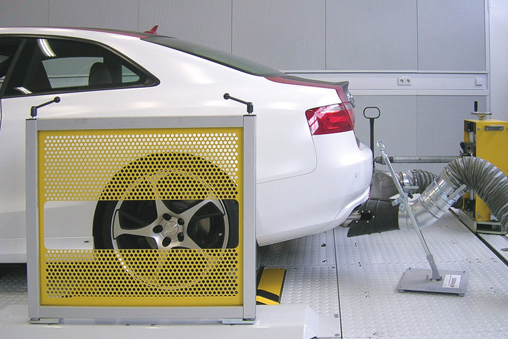 tire blow out wall - dyno roll - exhaust pipe - exhaust pipe emissions testing - deck plating - emissions laboratory / lab